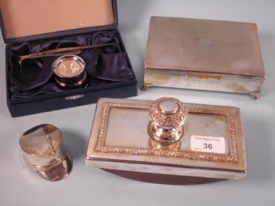 A silver inkwell and pen retailed by Harrods