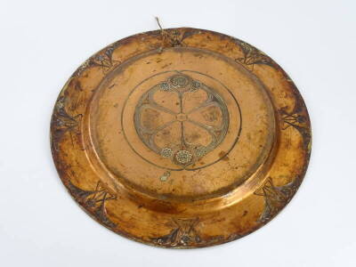 A late 19thC WMF Art Nouveau copper charger, decorated with flower heads, scrolls, etc., around a central patera, lozenge shaped bark to underside, 35cm diameter. - 2