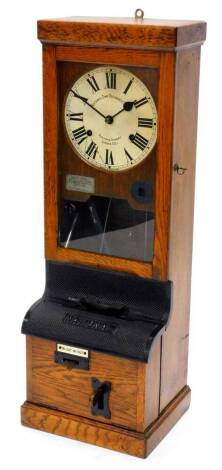 A National Time Recorder Company clocking in clock, the painted dial with Roman numerals in an oak case with bronzed iron fittings, 97cm high, 34cm wide.