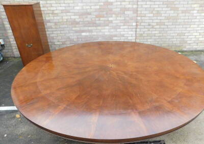 A high quality mahogany 'Jupe' style extending dining table in Regency manner by Arthur Brett of Norwich, model 19231, the circular top inlaid with a central star and with radiating veneers, with concave leaf extensions on a large bulbous turned column, a - 3