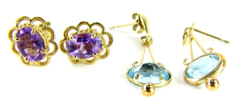 Two 9ct gold earrings, comprising a pair of amethyst floral cluster earrings, with butterfly backs, and a pair of aquamarine drop earrings, 3.2g all in.