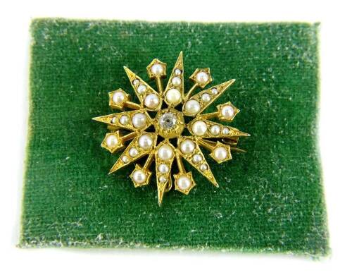 MS231120 - A 9ct gold diamond and pearl star brooch, with central old cut diamond, 3.2mm x 2mm, approx 0.13cts, with layered design of pearls, 3cm wide, 5.4g all in. Re-image