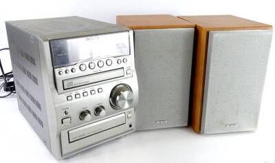 An Aiwa compact stereo system, XR-EM70, in original box and packaging, with remote.