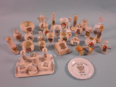 A large quantity of Goss and other crested china to include a model of an incendiary bomb