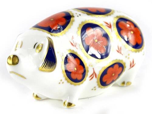 A Royal Crown Derby pig paperweight ornament, silver stopper, printed marks beneath, 13cm wide.