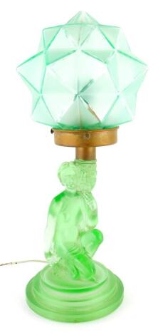 A mid 20thC Art Deco green glass moulded table lamp, with metal fitting and green bowl with star shaped shade, the main body 33cm high, unmarked.