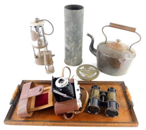 Various metalware, etc., Edwardian oak tray, a miners lamp of cylindrical form, marked Eccles 014, 24cm high, another smaller, shell case, copper kettle, etc., (a quantity).