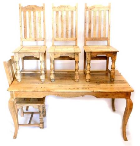 A light coloured hardwood dining table, in French style, the rectangular top with a shaped edge on cabriole legs, 76cm high, the top 90cm x 153cm, and four similar chairs.