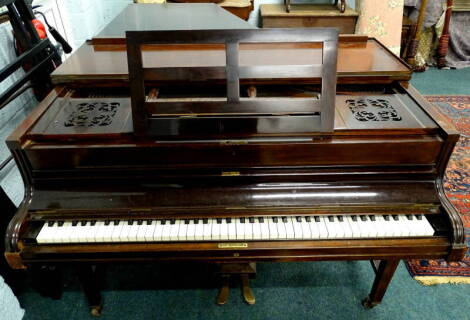 John Broadwood and Sons, London. A rosewood cottage grand piano, on square tapering legs, no visible frame number, 128cm W.