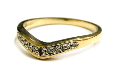 A 9ct gold dress ring, of wishbone design, set with tiny diamonds in platinum setting, ring size K, 1.4g all in.