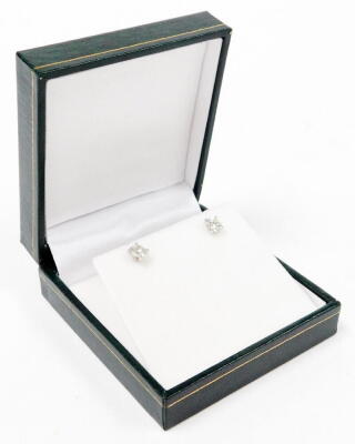 A pair of 18ct white gold diamond stud earrings, the round brilliant cut diamonds, set in four claw setting, each stone approx 4.8mm x 4.8mm x 4.2mm, totalling 1.09cts overall, on single pin back, with butterfly backs, 2.2g all in, boxed.