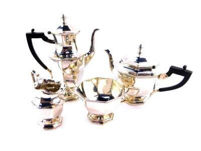 A George V silver four piece tea and coffee set, of octagonal baluster form, comprising teapot, cream jug, sugar bowl and coffee pot, Goldsmiths & Silversmiths Company, London 1918, 64.73oz.