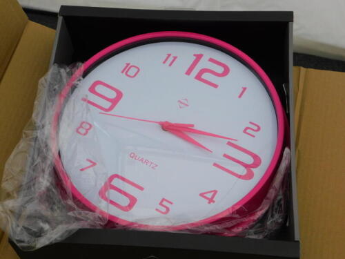 A Symple Stuff pink wall clock, RRP £24.13.