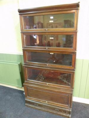 A Globe Wernicke mahogany five tier sectional bookcase with three