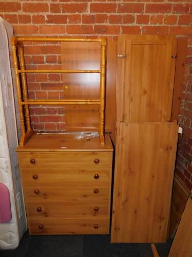 A pine effect three door wardrobe (flat pack), together with a matching five drawer chest, and a towel rail. (3)