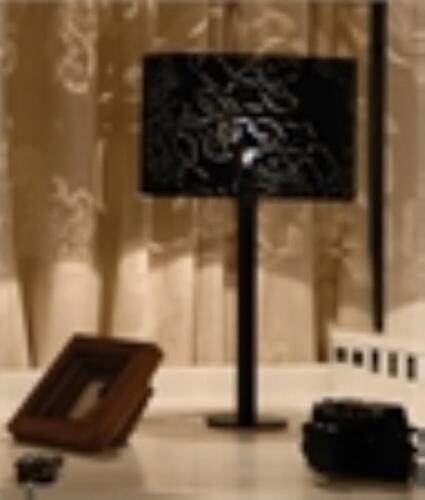 A designer table lamp, with black flower fret work shade, Peony, designed by Meiha Tsang for Innermost. RRP £150., Donated by Lightstyles.co.uk of Essendine.NB. This lot is being sold on behalf of The Rotary Club of Stamford Burghley to raise funds for th