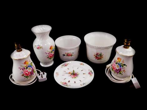 A group of Aynsley porcelain decorated in the Howard Sprays pattern, comprising a pair of table lamps, two graduated jardineres, a vase and a wall clock. (6)