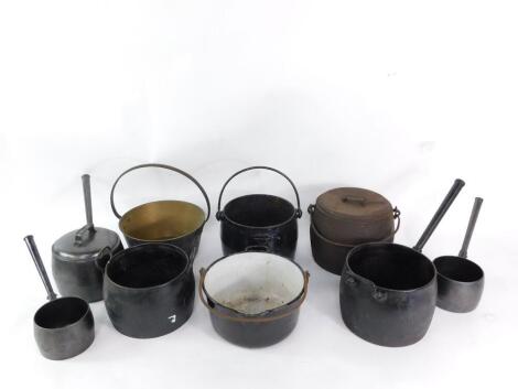 A Kenright No 11 two gallon cast iron cooking pot, two further cast iron cooking pots, a brass jam pan, enamelled pan, cast iron saucepan, Canon No 4 three pints saucepan, and two further saucepans. (9)