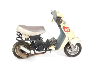 A child's Monkey bike, with Fun Scooter 65 Moto Sports decals.