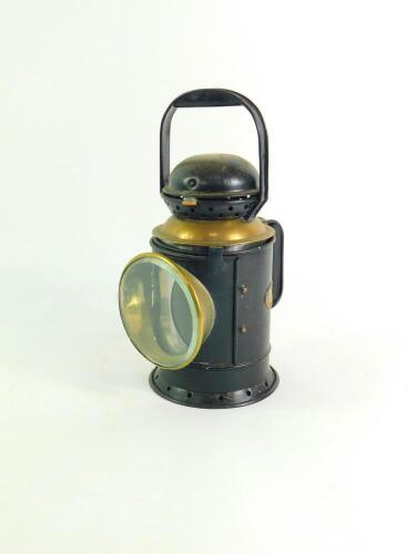 A G Polkey Ltd black painted tin and brass railway lamp, bears plaque, 30cm high.