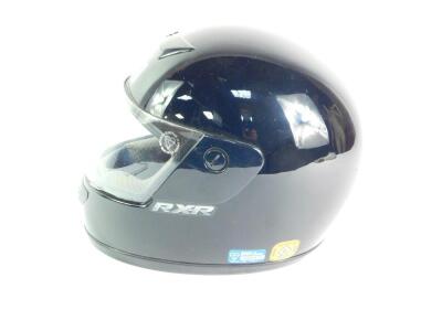 A Shoei RX-R black motorcycle helmet. - 2