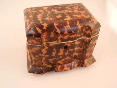 A 19thC tortoiseshell tea caddy of serpentine form