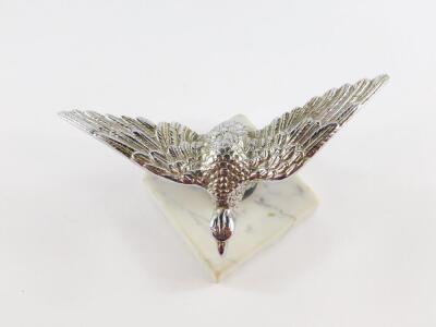 An Alvis 1930's chrome cast mascot, modelled as a Desmo Eagle raised on a ball, on a veined white marble base, 18cm wide. - 2