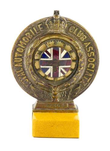 A Royal Automobile Club Association badge, no N73641, with enamel Union Jack flag and verso 1930 insert, by D.G Collins Ltd, London., raised on a marble base, 9cm wide.