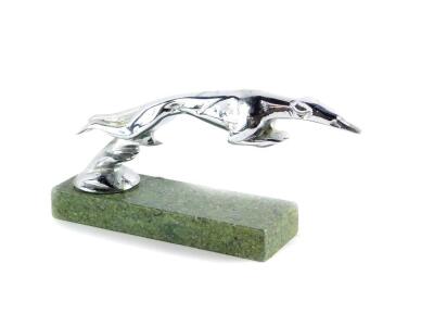 A car mascot of a leaping greyhound, after a design by Casimir Brau, raised on a marble base, 19.5cm wide.