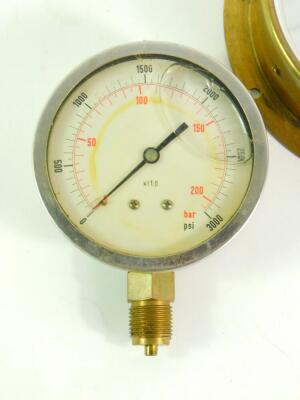 A Tomey brass cased circular altitude gauge, 18cm diameter., a Bar and PSI gauge, and a vacuum in. HG. gauge.(3) - 2