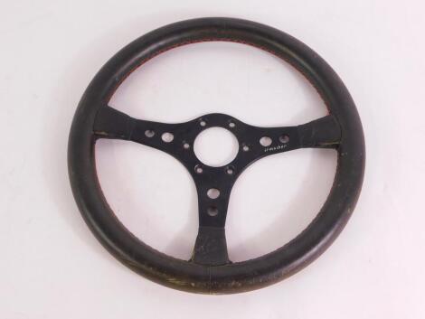 An Irmscher Opal / Vauxhall three spoke steering wheel, leather bound, serial no E1 / 0270503, 35.5cm diameter.