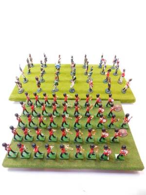 A set of Britains Grenadier Guards Bandsman, board mounted. (51)