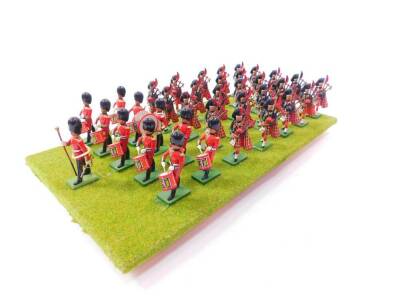 A set of Britains Scots Guards Bandsmen, board mounted. (36)