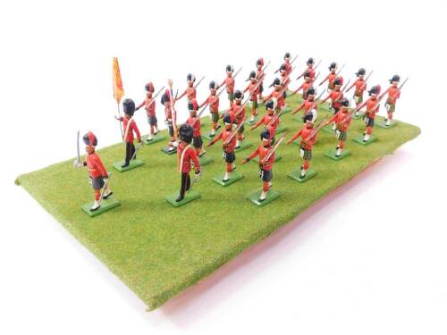 A set of Britains Scots Guards, board mounted. (28)