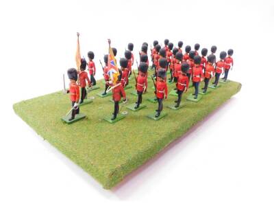 A set of Britains Grenadier Guards, board mounted. (33)