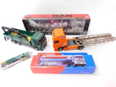 A NewRay die cast model of a long hauler, scale 1:32, boxed., an Esso Collection Road Tanker, boxed., Holland Express Low Loader., Travis Perkins Volvo open bed lorry, and a Search Impex Ltd Travis Perkins lorry. (5)