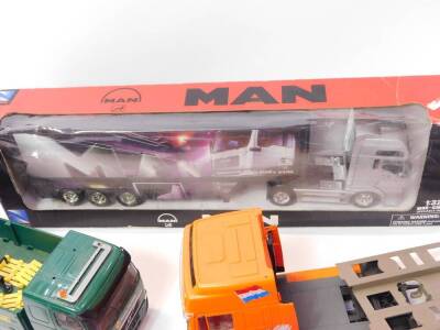 A NewRay die cast model of a long hauler, scale 1:32, boxed., an Esso Collection Road Tanker, boxed., Holland Express Low Loader., Travis Perkins Volvo open bed lorry, and a Search Impex Ltd Travis Perkins lorry. (5) - 2