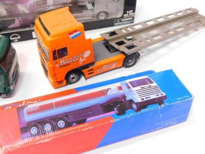 A NewRay die cast model of a long hauler, scale 1:32, boxed., an Esso Collection Road Tanker, boxed., Holland Express Low Loader., Travis Perkins Volvo open bed lorry, and a Search Impex Ltd Travis Perkins lorry. (5) - 4