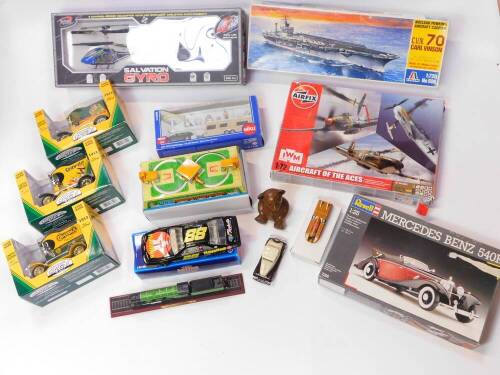 Three Crayola Goodyear Collector Series coin banks, a Bladez Toys Salvation Gyro., Italeri Nuclear Powered Aircraft Carrier CVN70 Carl Vinson., Siku Super Car with Caravan., and further toys and kits. (a quantity)