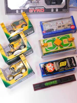 Three Crayola Goodyear Collector Series coin banks, a Bladez Toys Salvation Gyro., Italeri Nuclear Powered Aircraft Carrier CVN70 Carl Vinson., Siku Super Car with Caravan., and further toys and kits. (a quantity) - 3