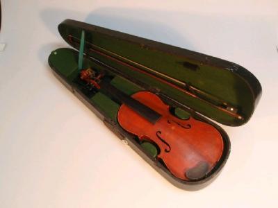 A students violin, with two-piece back, ebonised finger board and carved