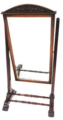 A 19thC mahogany cheval mirror, of rectangular form with a scroll carved fret, on a turned mahogany base, with shell carved sides and leaf carved feet, terminating in castors, the mirror 40cm high, 69cm wide, the frame 52cm high, 80cm wide, 56cm deep.