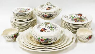 A Royal Doulton Hampshire pattern part dinner service, no. D6141, with decoration of a fruit bowl and flowers, comprising a set of four graduated meat plates, two gravy boats, two tureens and lids, twelve dinner plates, twelve side plates and twelve bread