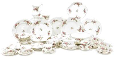 A Royal Albert Moss Rose pattern part tea and dinner service, comprising six cups and saucers, six coffee cups and saucers, sugar bowl, gravy boat and plate, open vegetable lid, six side plates, nine side bowls, cake plate, platter, seven dinner plates an