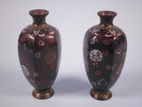 A pair of Japanese cloisonne baluster shaped hexagonal vases