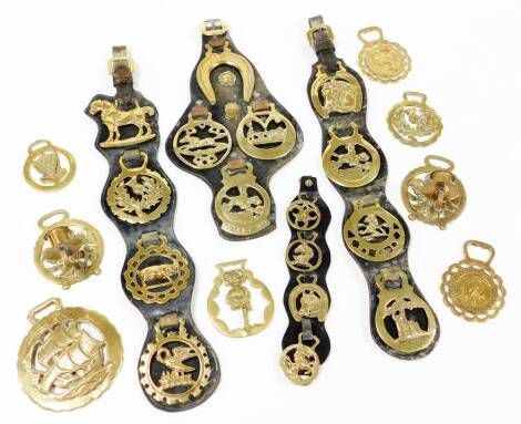 A collection of late 19thC and later horse brasses, comprising Cornwall Boscastle, John O'Groats, Courage Shire Horse Centre, Royal Commemorative Prince of Wales and Lady Diana Spencer wedding brass, four sets of martingales, a ship's brass and two rose a