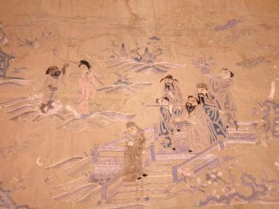 A 19thC Chinese silk panel embroidered with figures on a bridge