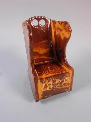 A Victorian slipware model of a country rocking chair