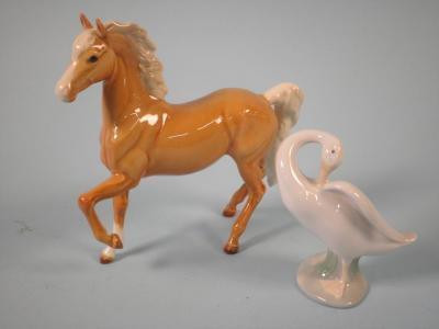 A Beswick pale brown horse with a white mane and a Lladro goose