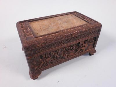 A carved Chinese rectangular box decorated with figures and trees